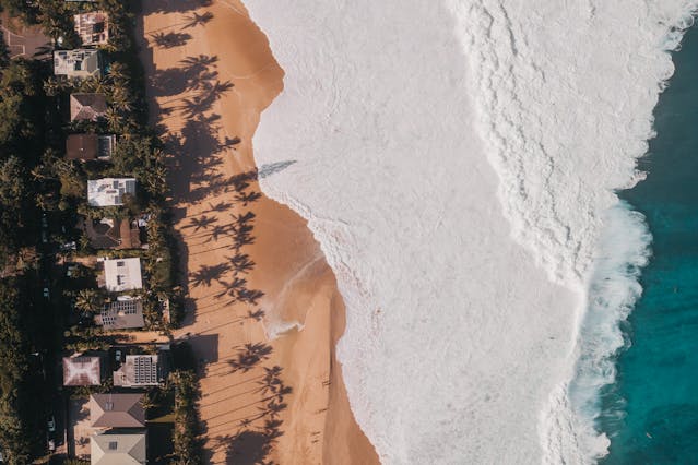 a bunch of houses by the beach
